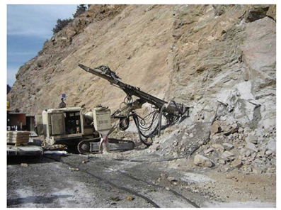 Rock Bolt Installation with a Track Drill. Courtesy of FHWA