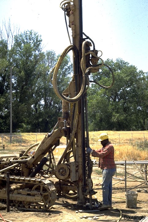 Air percussion rig installing grout pipe on site. (Courtesy of Dr. Ross Boulanger, UC Davis).