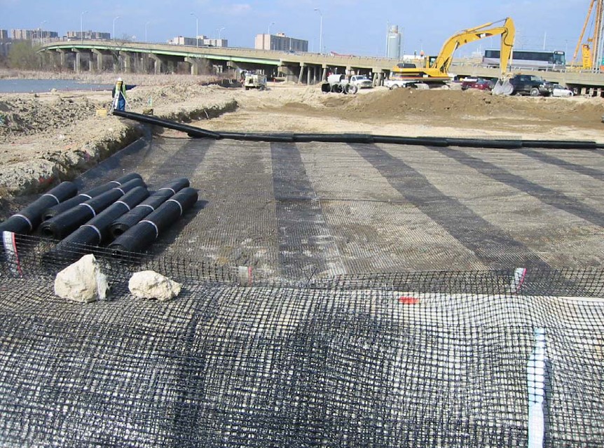 Placement of geosynthetic reinforcement for Column-Supported Embankment (CSE) From FHWA (2004).