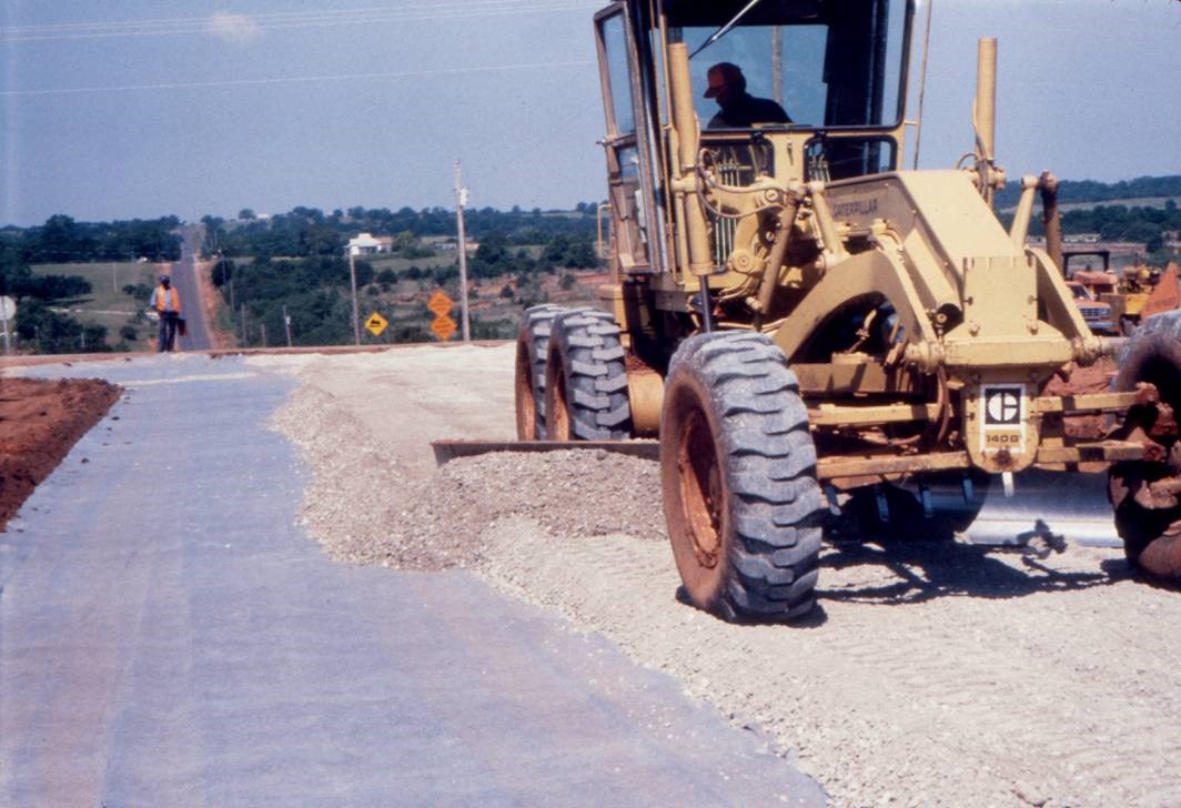 Placement of base course materials over the geotextile in roadway. Courtesy Minnesota Department of Transportation.