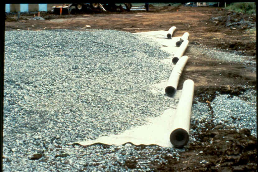 Placement of geotextile in roadway. Courtesy National Highway Institute.