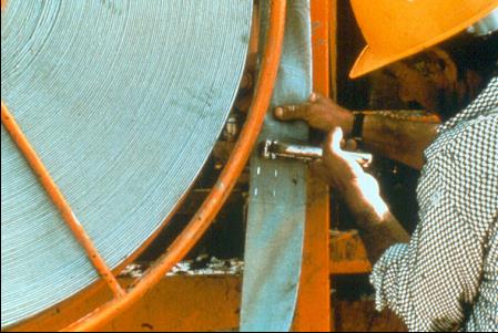 Stapling the PV Drain Splice. Courtesy of Geotechnics B.V. Stapling the PV Drain Splice. Courtesy of Geotechnics B.V.