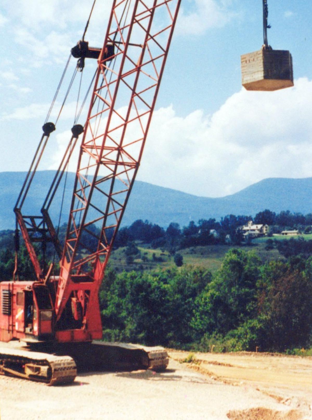 Large crane and 14.0 Mg (30.9 kips) tamper for dynamic compaction. Photo courtesy of Elias et al. (2006). Large crane and 14.0 Mg (30.9 kips) tamper for dynamic compaction. Photo courtesy of Elias et al. (2006).