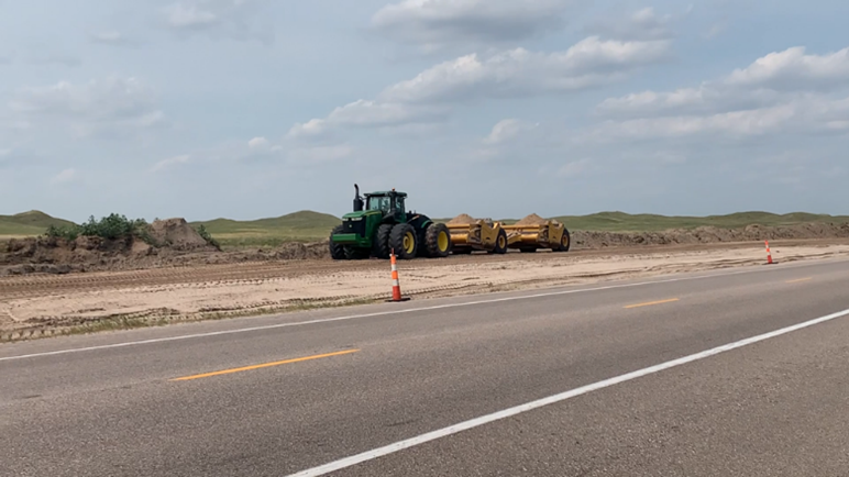 Final placement of materials on roadbed. 