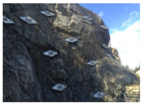 Rock dowels and wire mesh installed to stabilize the rock face